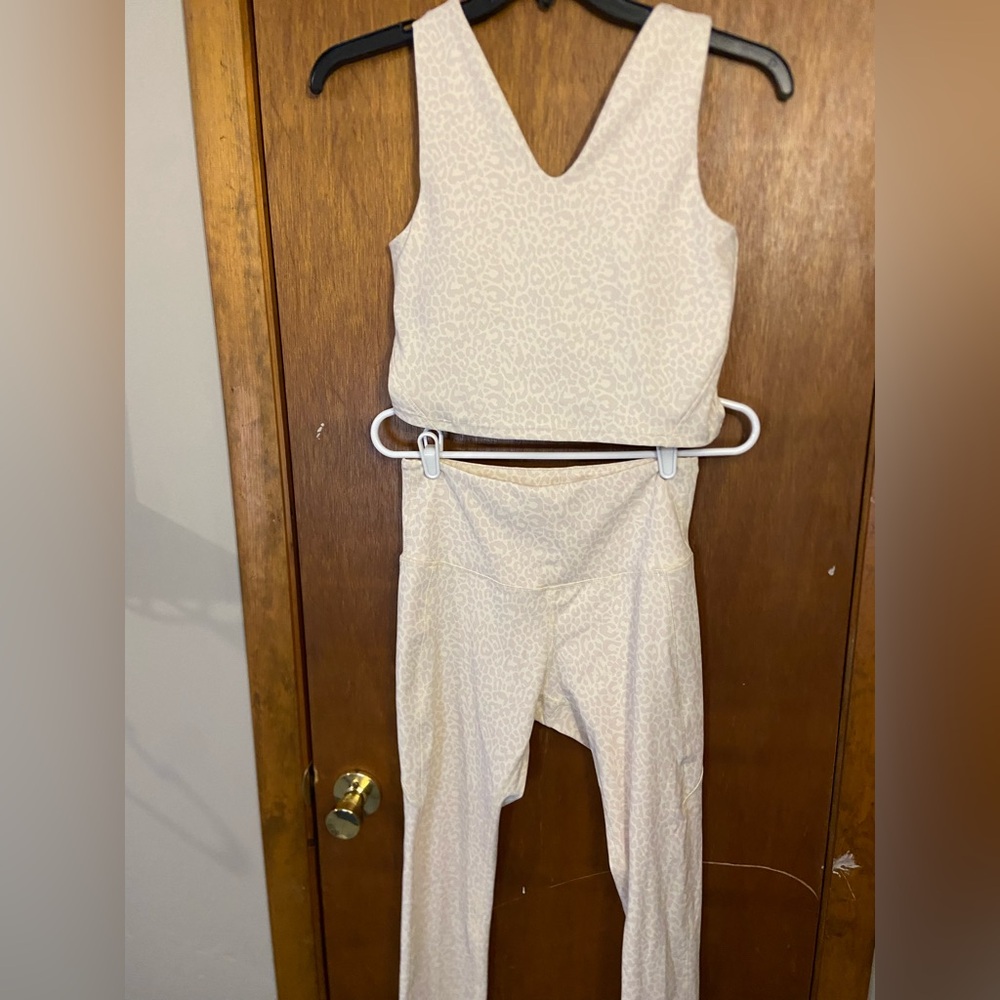 Move Theology cheetah print cream workout set